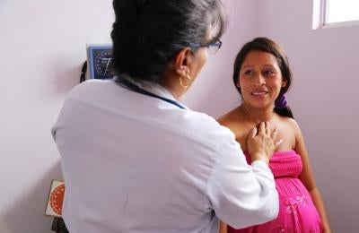 Doctor examining woman