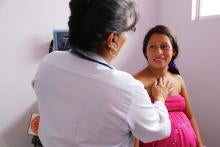 Doctor examining woman