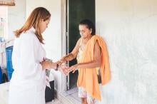 Doctor checking for leprosy